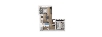 A small room with a bed, desk, and a refrigerator.