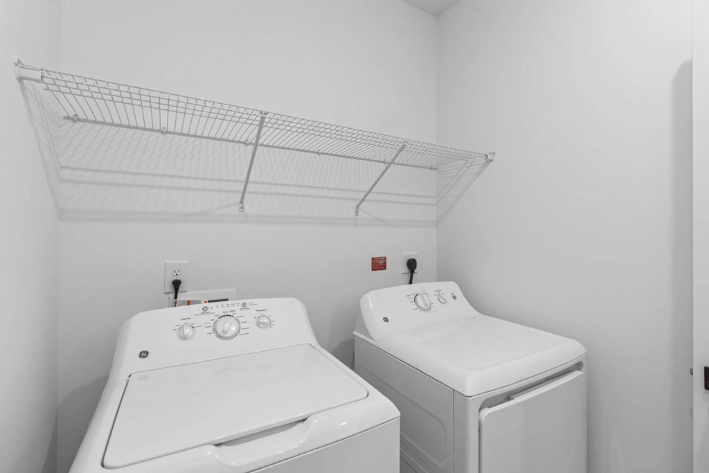 A laundry room with a washer and dryer.
