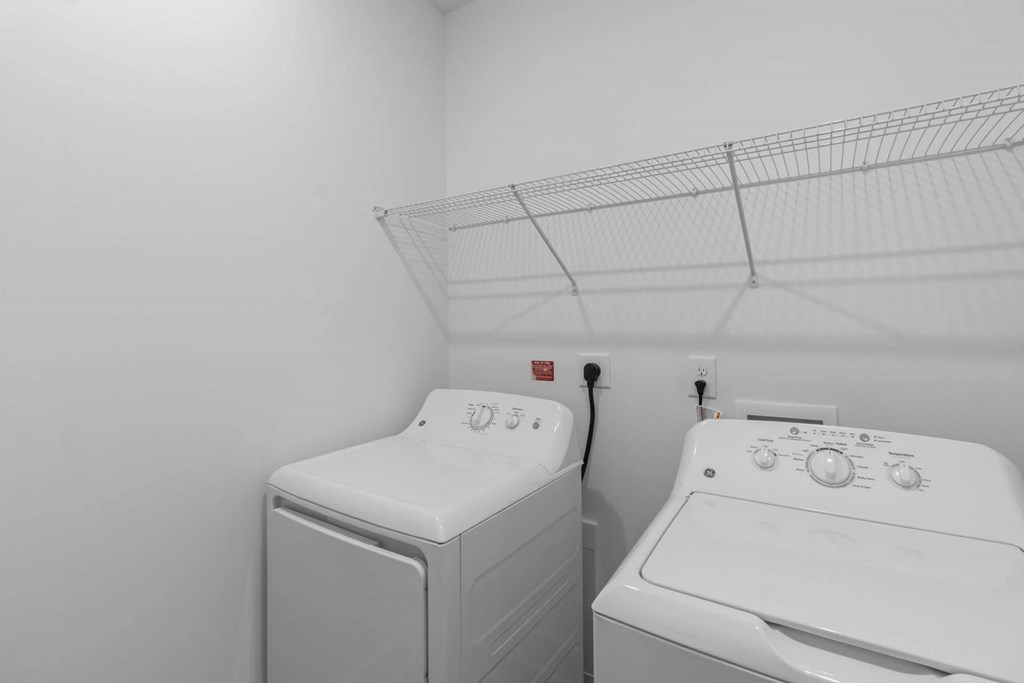 A laundry room with a washer and dryer.