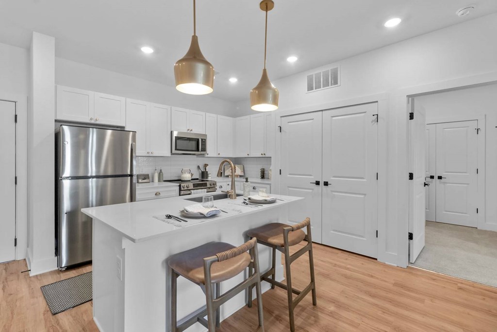 A modern kitchen with a white island