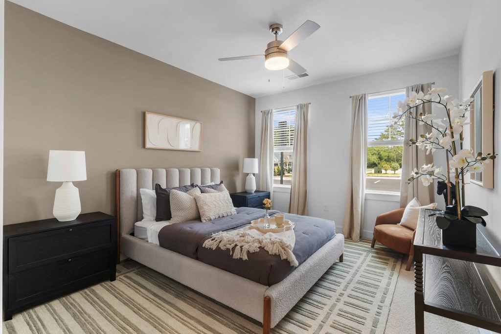 Bedroom with a ceiling fan.