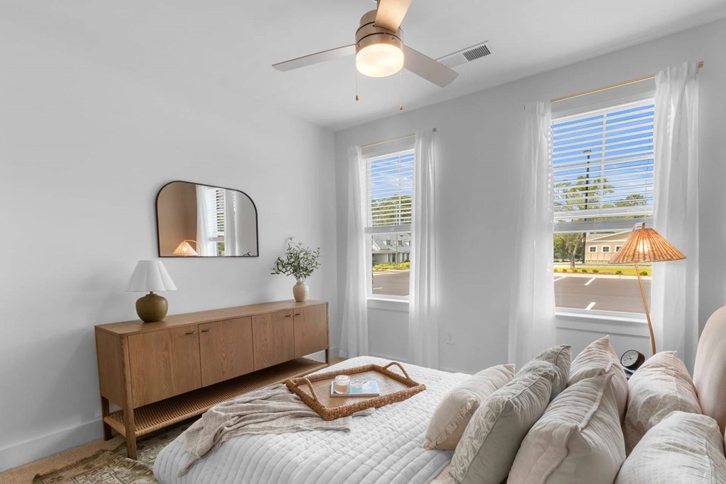 Bedroom with a ceiling fan.