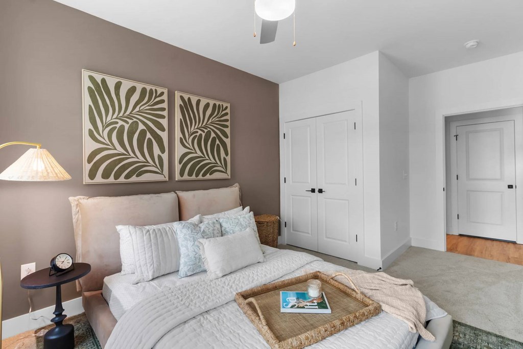 Bedroom with a ceiling fan.