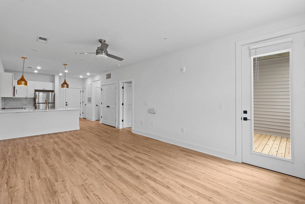 A room with wooden floors and white walls.