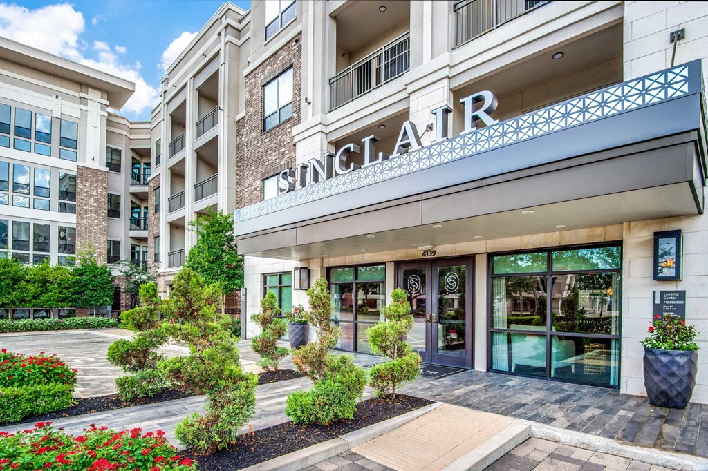 The front of a building with the name SINGLAIR on it.