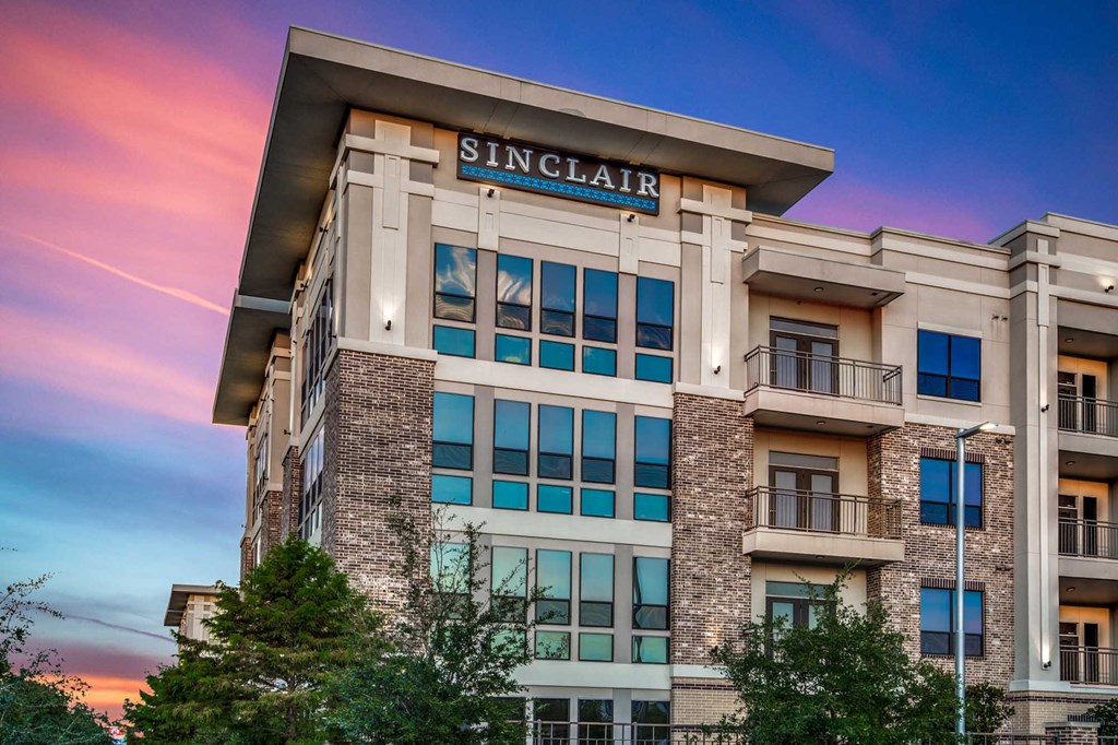 The image shows a building with the name "SINCLAIR" on it.
