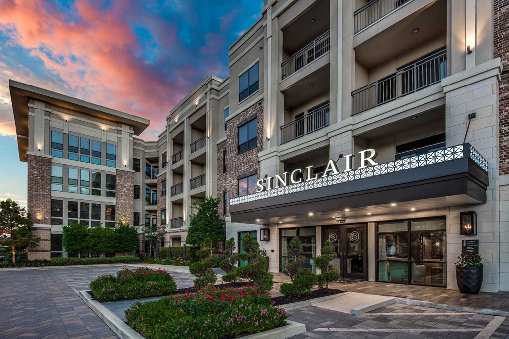 The image shows a building with the name "SINGLAIR" on it.