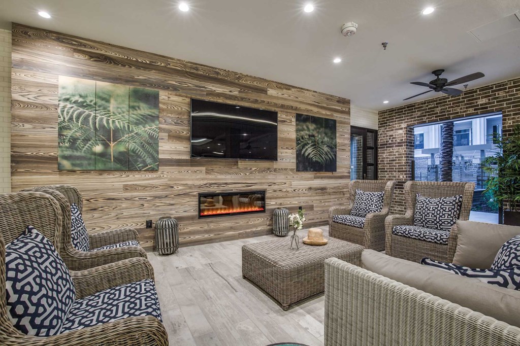 A living room with a fireplace and a television.
