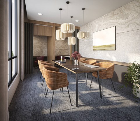A modern dining room with a large table and chairs.
