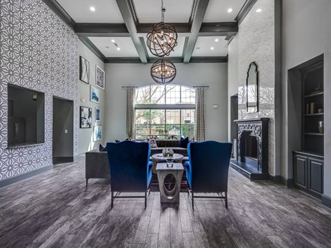 A modern living room with a dining table and chairs.