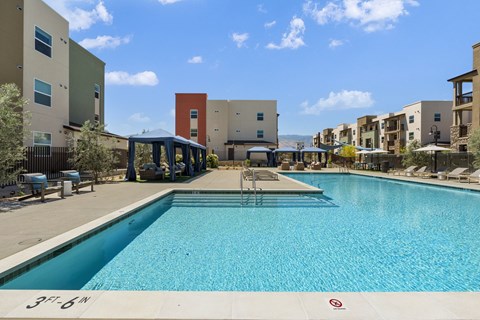 A swimming pool in front of a building with a sign that says 37-6N.