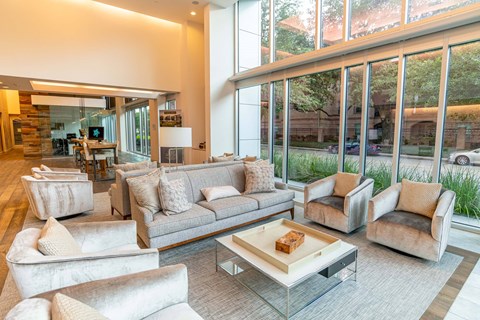 A living room with a large couch and a coffee table.