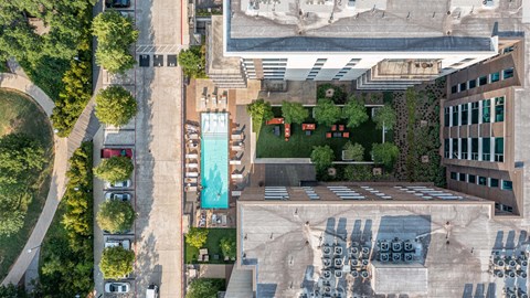 A large building with a pool in the middle of it.
