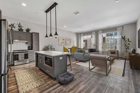 A modern kitchen with a refrigerator, oven, and a dining table with chairs.