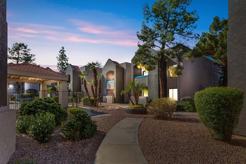 A modern residential area with a well-maintained garden and pathway.