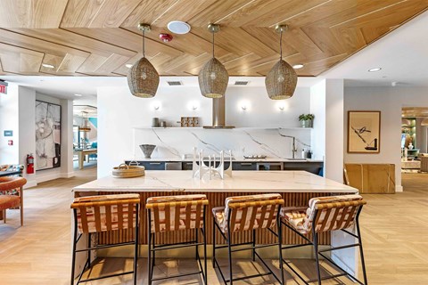 A modern dining room with a wooden table and chairs.
