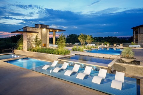 A modern house with a pool in the backyard.