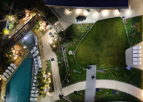 A backyard with a pool and a slide.