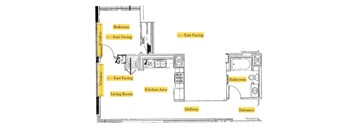 A floor plan of a house with a living room, kitchen area, bedroom, bathroom and hallway.