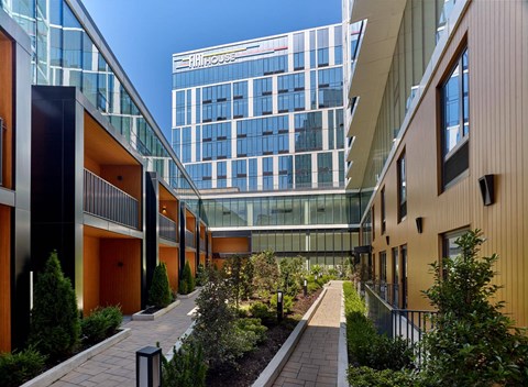 A modern building with a glass facade is visible in the background.