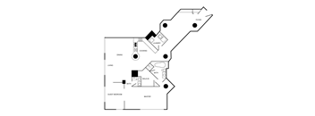 A floor plan of a house with a foyer, living room, dining room, kitchen, laundry, and guest bedroom.