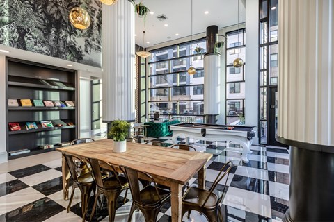 A dining area with a wooden table and chairs.
