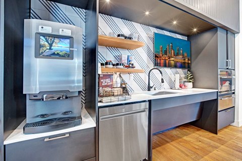 A modern kitchen with a stove and a fridge.