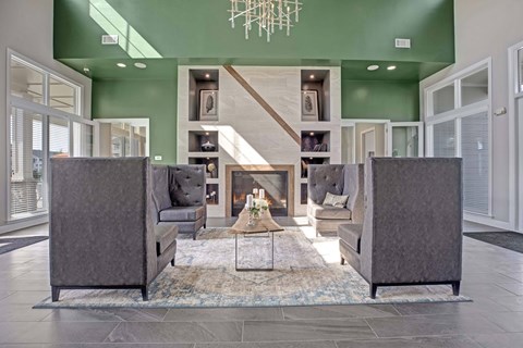 A modern living room with a grey sofa and a coffee table.