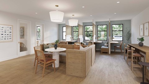 A well-lit, spacious kitchen and dining area with wooden floors and furniture.