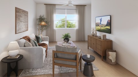 A living room with a grey couch, a wooden table, and a painting on the wall.