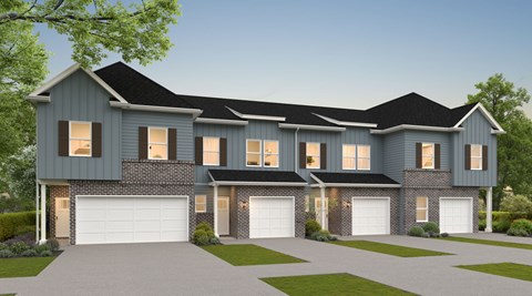 A modern house with a grey exterior and a black roof.