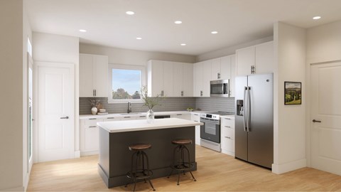 A modern kitchen with white cabinets and stainless steel appliances.