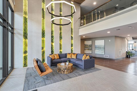 A modern living room with a large sofa and a coffee table.