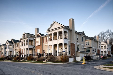 A large apartment complex with multiple buildings and balconies.
