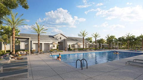 A swimming pool surrounded by palm trees and a building in the background.