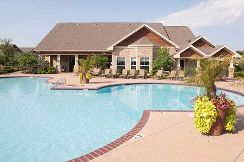 A house with a pool in the backyard.