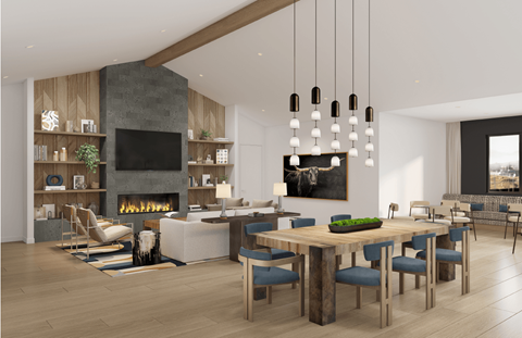 A modern dining room with a fireplace and a large painting on the wall.