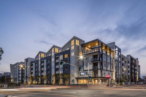 A modern apartment building with the number 4351 on it.