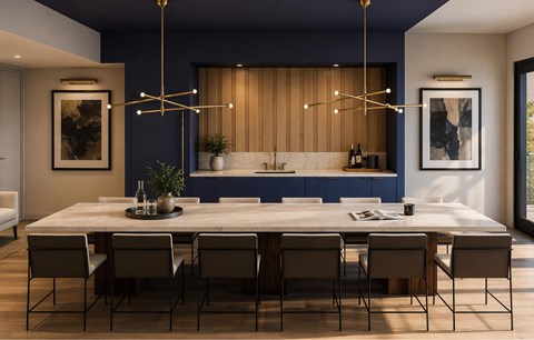 A modern dining room with a large table and chairs.