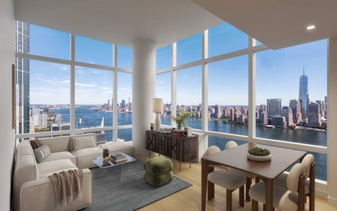 A living room with a view of the city skyline.