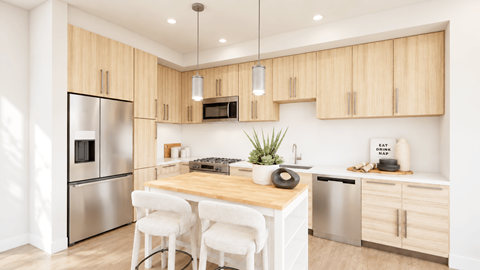 A modern kitchen with wooden cabinets and stainless steel appliances.