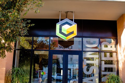 A storefront with a sign that reads "ASTRO" and a logo above the door.