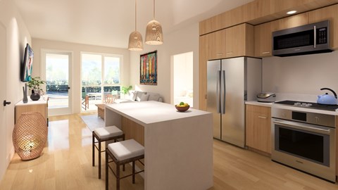 A modern kitchen with a refrigerator, oven, and sink.