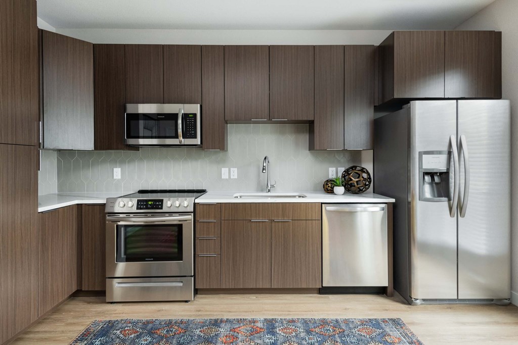 Cabinet pace and stainless steel appliances at PARK40, Broomfield, Colorado