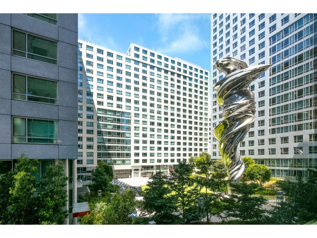 Luxury Apartments In San Francisco, CA - Public Courtyard In The Middle Of Apartment Buildings. Courtyard Has Maintained Landscaping, Trees, And A Art Instillation Called The Venus.