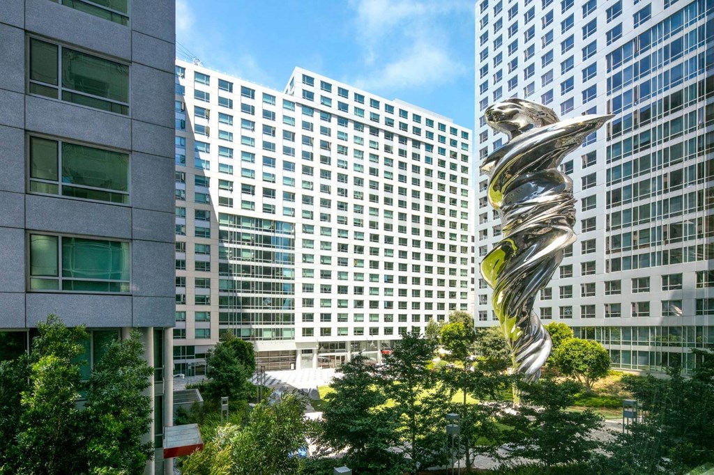 a large metal sculpture in the middle of a city