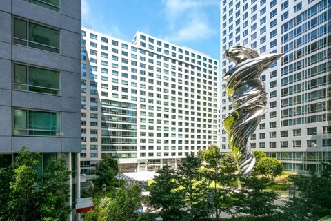 a large metal sculpture in the middle of a city