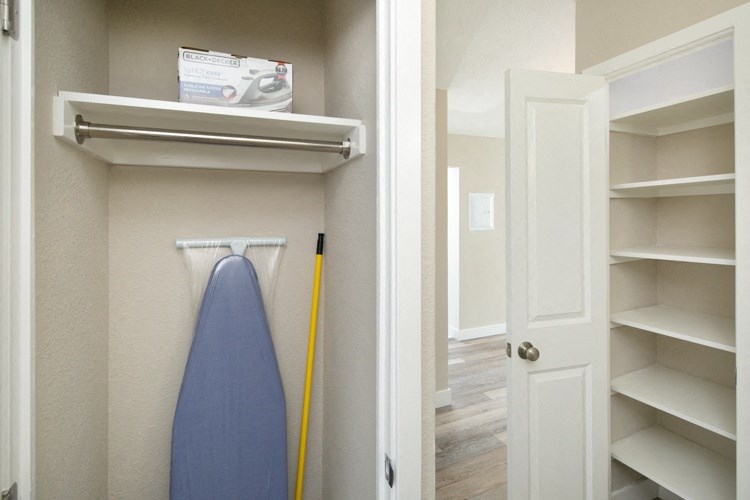 a walk in closet in a 555 waverly unit