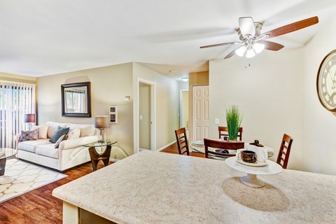 A dining room with a table set for two.