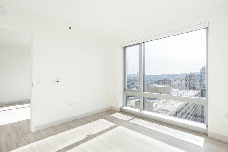 an empty room with a large window